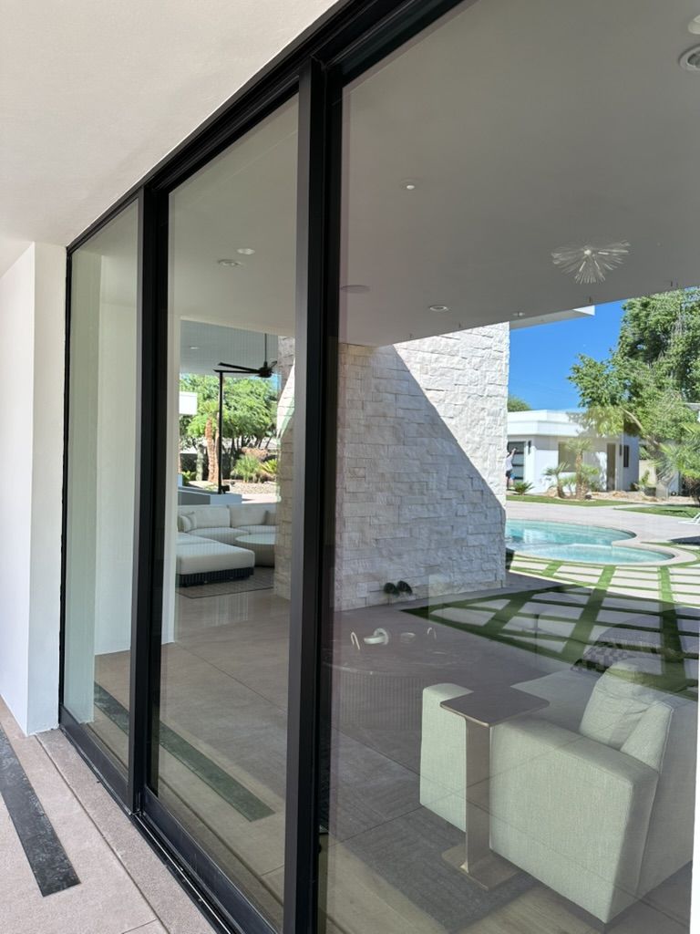 Clear sliding doors looking out to the pool